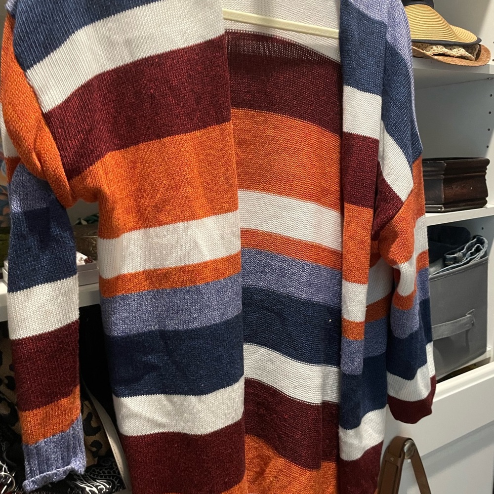 Multi-colored mid length cardigan. This is  pre owned worn by me Size medium.
